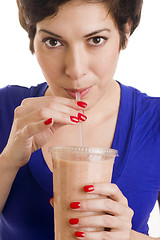 Image showing Woman sips Flesh Tone Smoothie