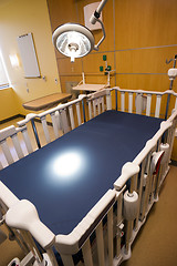 Image showing Medical Inspection Light Shines Down Bed Childrens Hospital Room