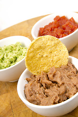 Image showing Food Appetizers Chips Salsa Refried Beans Guacamole Wood Cutting