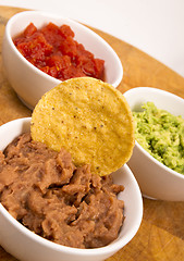 Image showing Chips Salsa Refried Beans Guacamole Nachos Food Fresh Appetizer