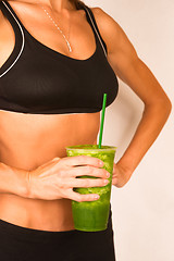 Image showing Slender Female Torso Tanned Toned Body Blended Fruit Smoothie Dr