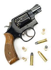 Image showing Wood Handled Revolver 38 Caliber Pistol Loaded Laying With Bulli