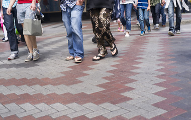 Image showing Multiple People Casually Dressed Walking in Crosswalk Downtown S