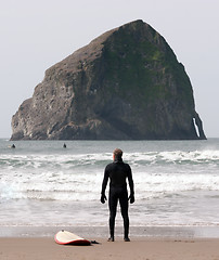 Image showing Lone Surfer Stands Looking Ocean Surf Sea Waves Surf Sport