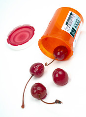 Image showing Food Cherries Roll out of Pharmacy Medicine Container