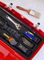 Image showing Orange Tool Box with Crescent Tape and Brush