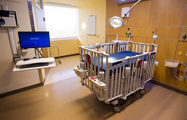 Image showing Medical Inspection Light Shines Down Bed Childrens Hospital Room