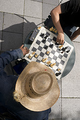 Image showing Man Moves Piece People Playing Chess Game Sidewalk Park Downtown