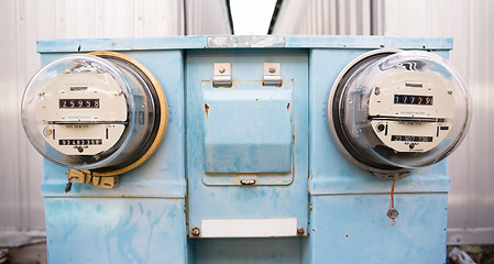 Image showing Dual Glass Dome Watt Hour Electric Utility Meters Dock Outside