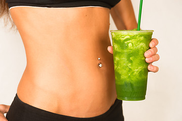 Image showing Slender Female Torso Tanned Toned Body Blended Fruit Smoothie Dr