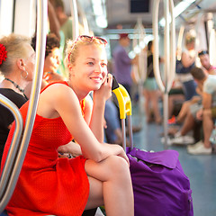 Image showing Lady traveling by metro.