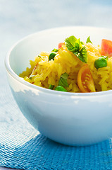 Image showing saffron (or curry) rice and vegetable salad