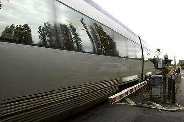 Image showing French train passing through unmanned level crossing, chenonceau, loire valley, france