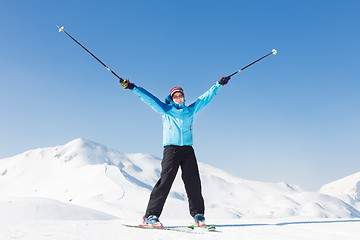 Image showing Excited woman skier.