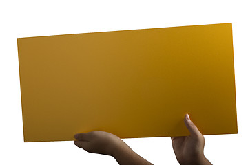 Image showing Plywood yellow sign held up by hands