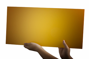 Image showing Plywood yellow sign held up by hands