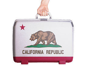 Image showing Used plastic suitcase with stains and scratches