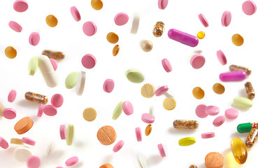 Image showing various falling pills