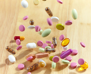 Image showing various falling pills