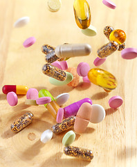 Image showing various falling pills