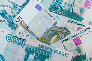 Image showing Euros and Russian roubles banknotes