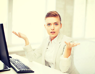 Image showing stressed businesswoman with computer