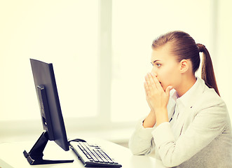 Image showing stressed student with computer in office