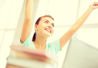 Image showing happy student girl with computer at school