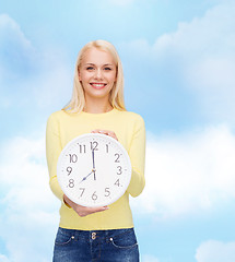 Image showing student with wall clock