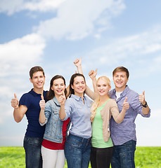 Image showing group of smiling students showing thumbs up