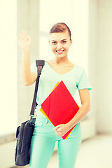 Image showing student with folders and school bag in college