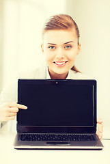 Image showing businesswoman with laptop in office