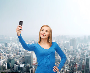 Image showing woman taking self picture with smartphone camera