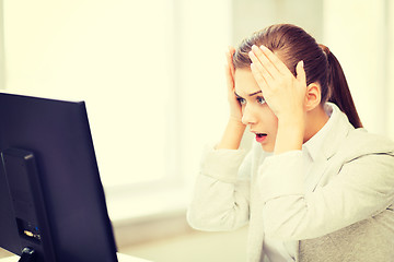 Image showing stressed student with computer in office