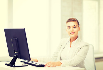 Image showing businesswoman with computer in office