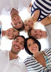 Image showing smiling friends in circle