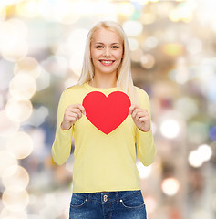 Image showing smiling woman with red heart