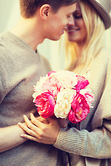 Image showing couple with flowers in the city