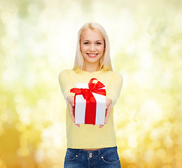 Image showing smiling girl with gift box