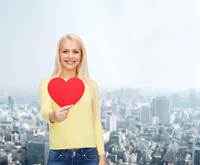 Image showing smiling woman with red heart