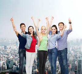 Image showing group of smiling students showing thumbs up