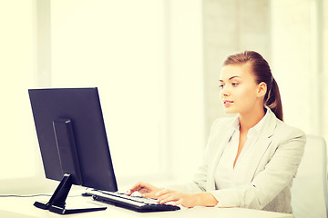 Image showing businesswoman with computer in office