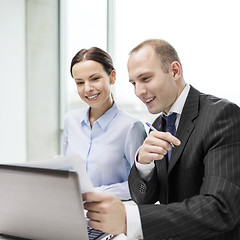 Image showing businessman and businesswoman having discussion