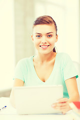 Image showing smiling student girl with tablet pc