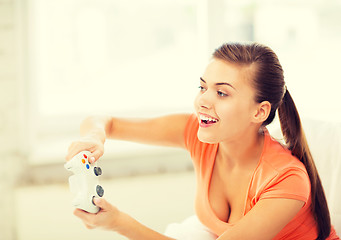Image showing woman with joystick playing video games