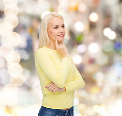 Image showing happy smiling woman dreaming