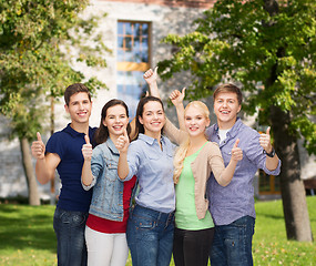 Image showing group of smiling students showing thumbs up