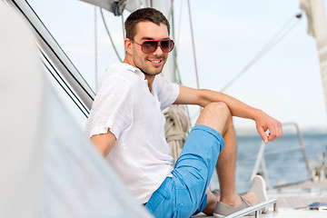 Image showing man sitting on yacht deck