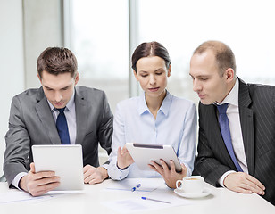 Image showing business team with tablet pc having discussion