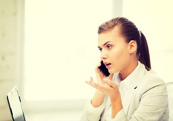 Image showing picture of confused woman with smartphone